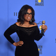 Oprah adds a little more gold and recognition to her collections at the 75th Golden Globes. (Photo: Frederic J. Brown/AFP/Getty Images)